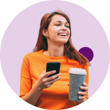 Happy women with cup of coffee and mobile