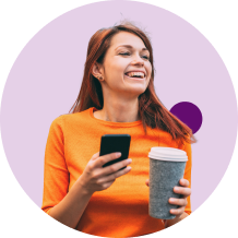 Happy women with cup of coffee and mobile