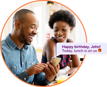 Man smiling at his birthday greeting message - Marketing automation